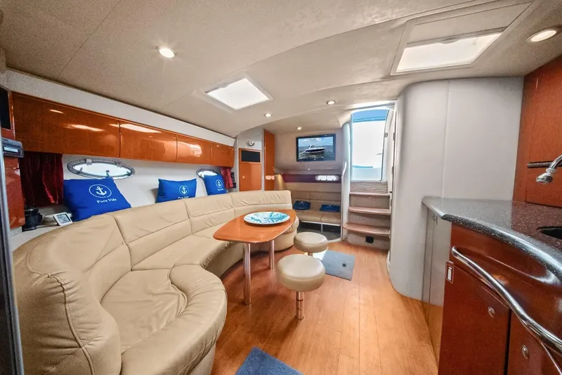 Pura Vida Yacht Photos Pics Luxurious interior of a 2008 Formula 40 Performance Cruiser with plush seating and modern amenities.