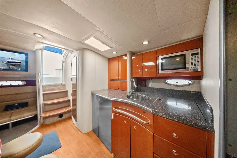 Pura Vida Yacht Photos Pics 2008 Formula 40 Performance Cruiser interior with modern kitchen and seating area.