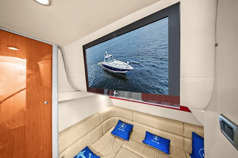 Pura Vida Yacht Photos Pics Interior of 2008 Formula 40 Performance Cruiser with TV and beige seating.