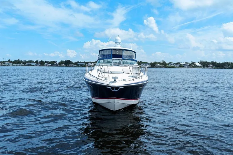 Pura Vida Yacht Photos Pics 2008 Formula 40 Performance Cruiser on open water under blue sky.
