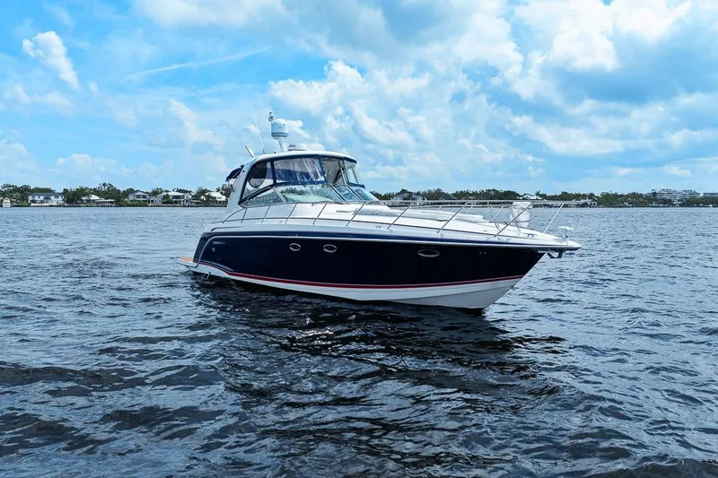 Pura Vida Yacht Photos Pics 2008 Formula 40 Performance Cruiser on open water under a partly cloudy sky.