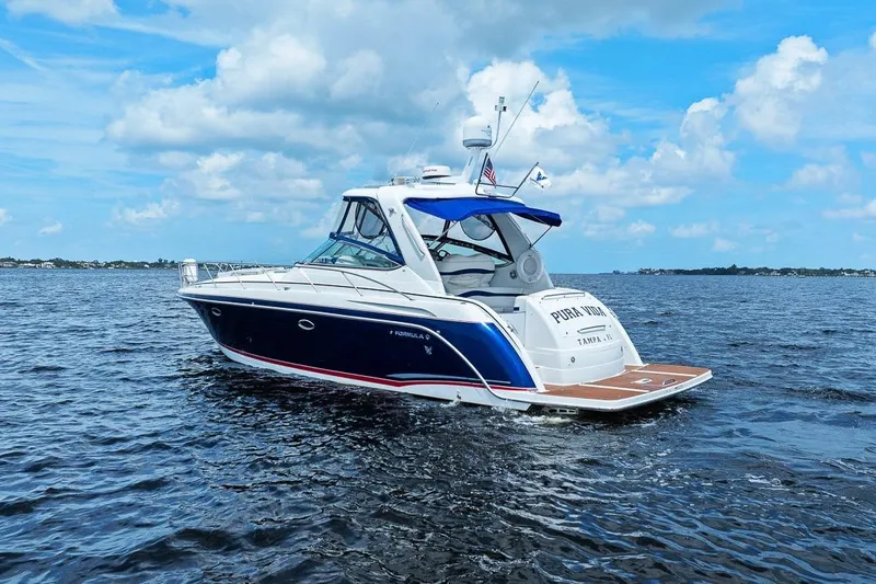 Pura Vida Yacht Photos Pics 2008 Formula 40 Performance Cruiser on open water under a blue sky.