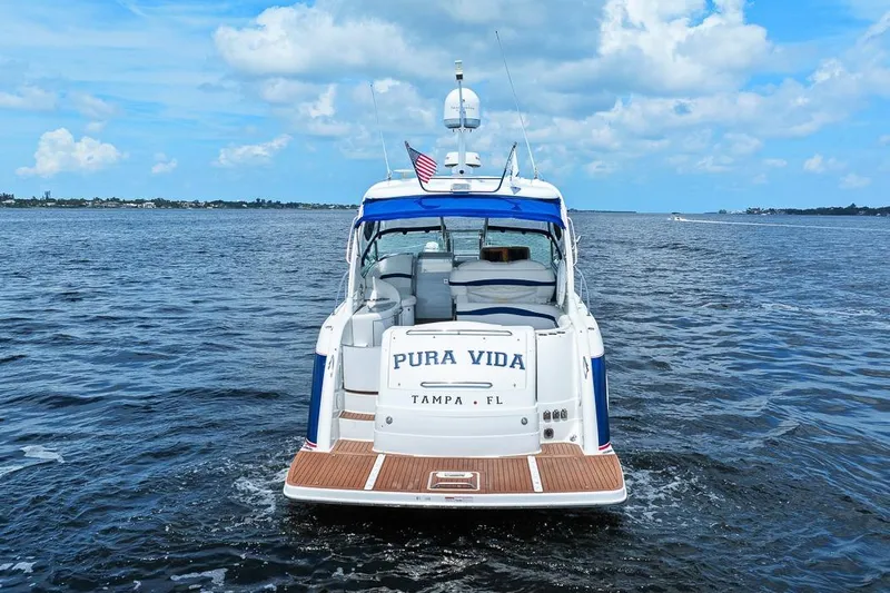 Pura Vida Yacht Photos Pics 2008 Formula 40 Performance Cruiser on open water, rear view, "Pura Vida" name visible.