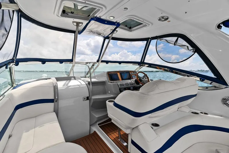 Pura Vida Yacht Photos Pics 2008 Formula 40 Performance Cruiser interior with white seating and ocean view.