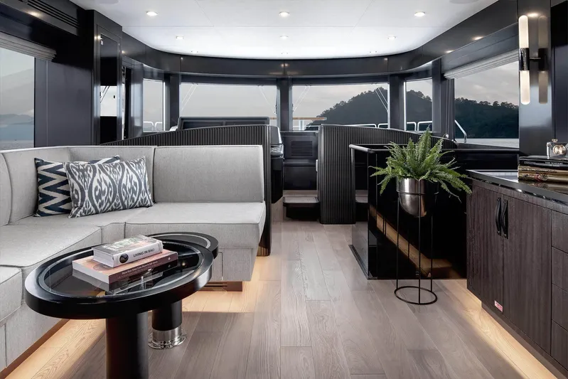  Yacht Photos Pics Luxurious interior of 2022 Sirena 68 yacht with modern decor and panoramic windows.