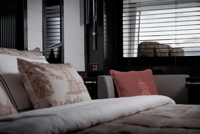  Yacht Photos Pics Luxurious interior of 2022 Sirena 68 yacht with elegant bedding and window blinds.