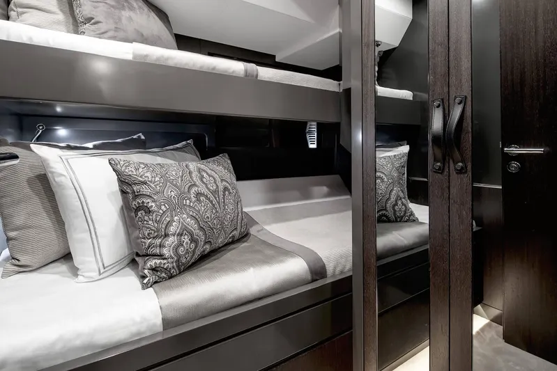  Yacht Photos Pics Luxurious 2022 Sirena 68 yacht interior with elegant bunk beds and stylish decor.