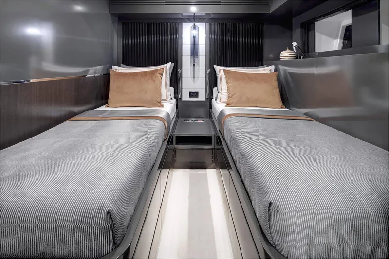  Yacht Photos Pics Modern twin cabin interior of 2022 Sirena 68 yacht with sleek design and neutral tones.
