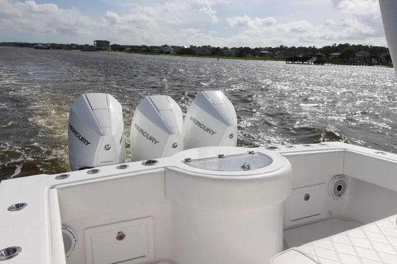  Yacht Photos Pics 2022 Onslow Bay 33 boat with triple Mercury engines on a sunny day.