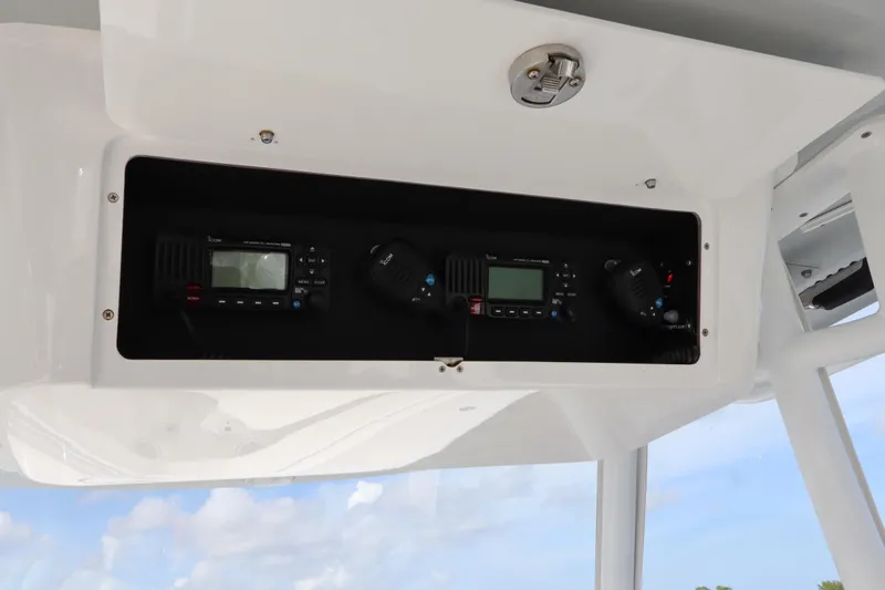  Yacht Photos Pics 2022 Onslow Bay 33 boat console with communication equipment and clear sky background.