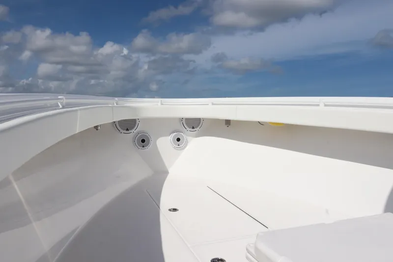  Yacht Photos Pics 2022 Onslow Bay 33 boat interior with speakers under a clear blue sky.