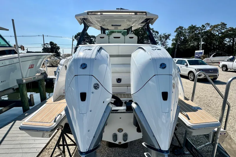  Yacht Photos Pics 2026 Tiara Yachts 34 LS with dual outboard engines, docked at a marina.