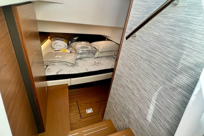  Yacht Photos Pics 2026 Tiara Yachts 34 LS cabin interior with bedding and wooden finishes.