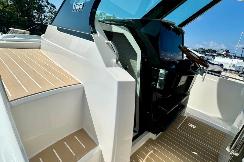  Yacht Photos Pics 2026 Tiara Yachts 34 LS cockpit with modern helm and sleek design.