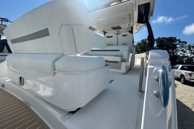  Yacht Photos Pics 2026 Tiara Yachts 34 LS interior with luxurious white seating and modern design.