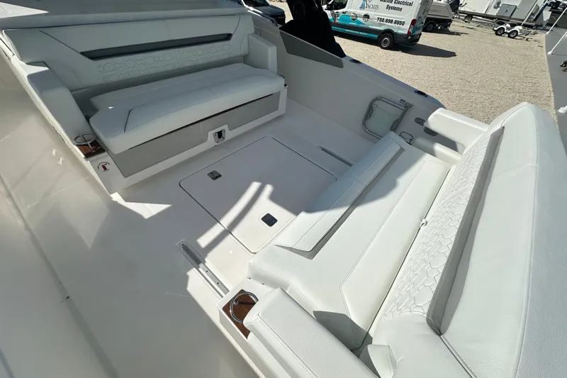  Yacht Photos Pics 2026 Tiara Yachts 34 LS interior with luxurious white seating and modern design.