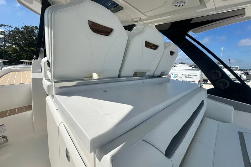  Yacht Photos Pics 2026 Tiara Yachts 34 LS interior with white seating and sleek design.