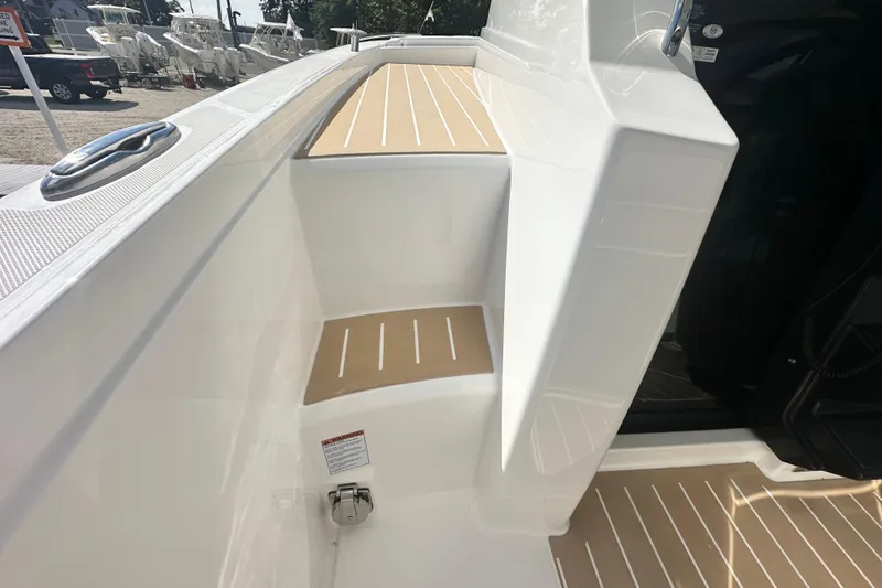  Yacht Photos Pics 2026 Tiara Yachts 34 LS boat deck with sleek white and tan design.