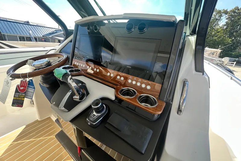  Yacht Photos Pics 2026 Tiara Yachts 34 LS helm with modern controls and sleek dashboard design.