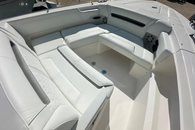  Yacht Photos Pics Luxurious seating area on 2026 Tiara Yachts 34 LS, featuring white upholstery and modern design.