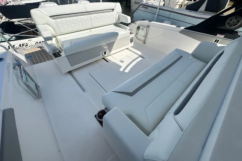  Yacht Photos Pics 2026 Tiara Yachts 34 LS interior with luxurious white seating and modern design.