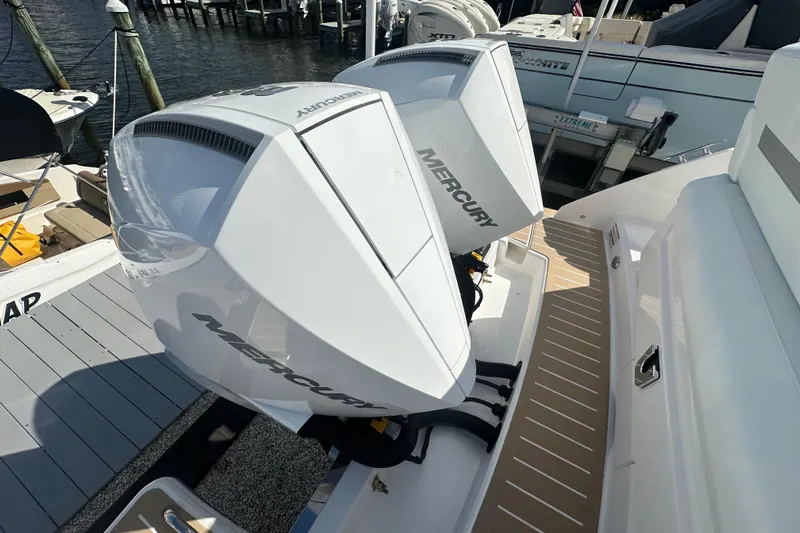  Yacht Photos Pics 2026 Tiara Yachts 34 LS with dual Mercury outboard engines at a marina.