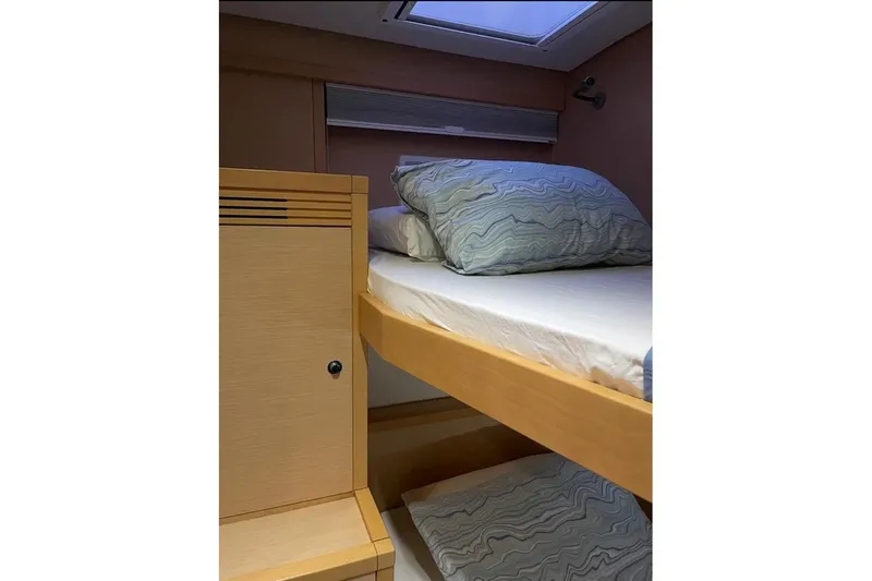 Somni Yacht Photos Pics Cozy cabin interior of 2013 Lagoon 560 S2 yacht with wooden bunk bed.