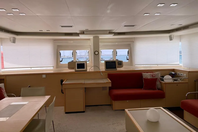 Somni Yacht Photos Pics Luxurious interior of 2013 Lagoon 560 S2 yacht with modern furnishings and sea view.