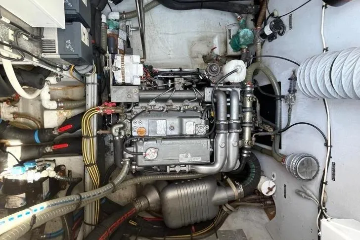 Somni Yacht Photos Pics Engine room of a 2013 Lagoon 560 S2 yacht, showcasing complex machinery and piping.