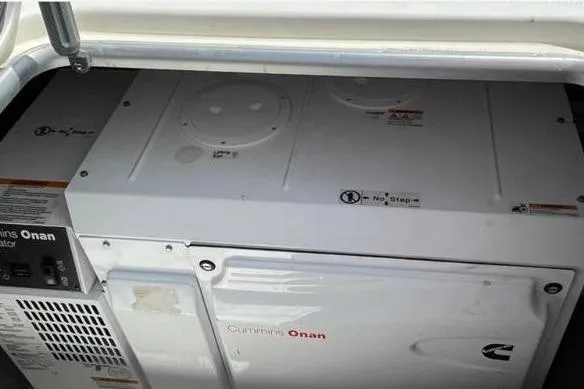 Somni Yacht Photos Pics Cummins Onan generator in a 2013 Lagoon 560 S2 yacht engine compartment.
