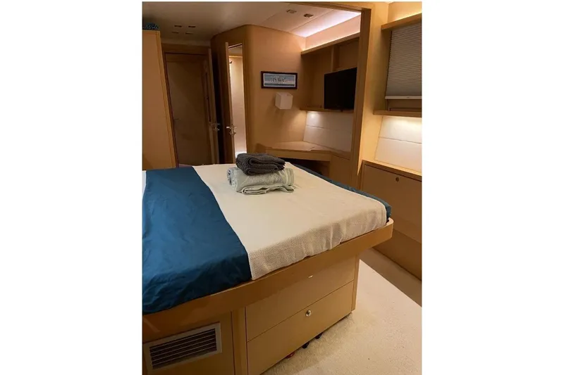 Somni Yacht Photos Pics Luxurious bedroom interior of 2013 Lagoon 560 S2 yacht with modern furnishings.