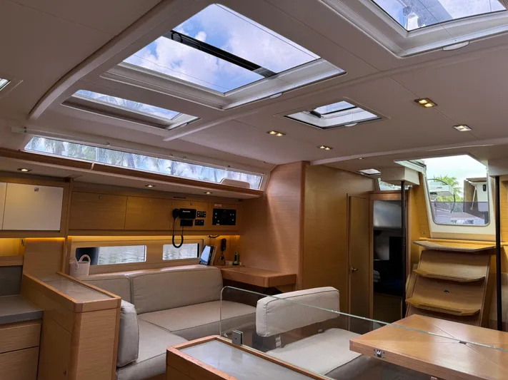 Pura Vida Yacht Photos Pics Luxurious interior of 2022 Dufour 530 yacht with skylights and modern furnishings.