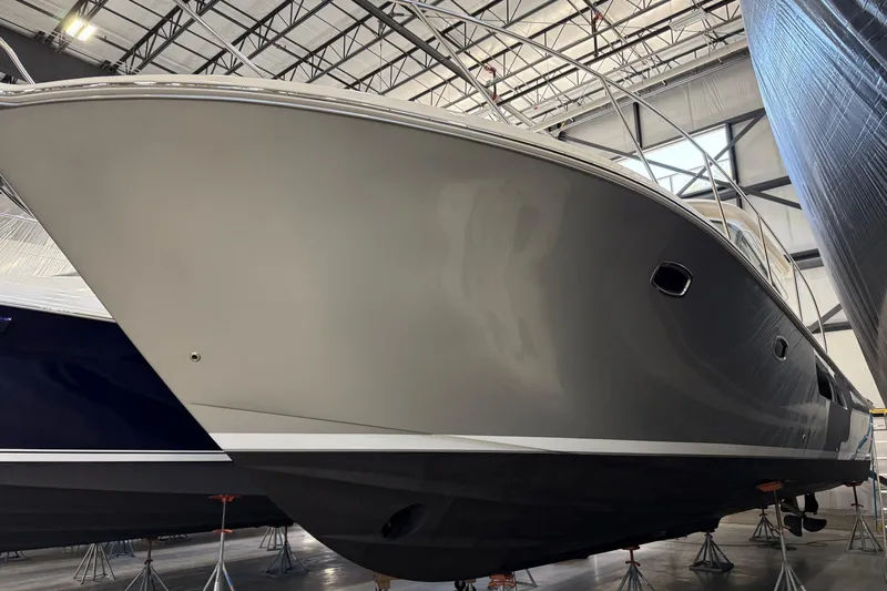  Yacht Photos Pics 2023 Tiara Yachts 43 Open in a showroom, showcasing sleek design and modern features.