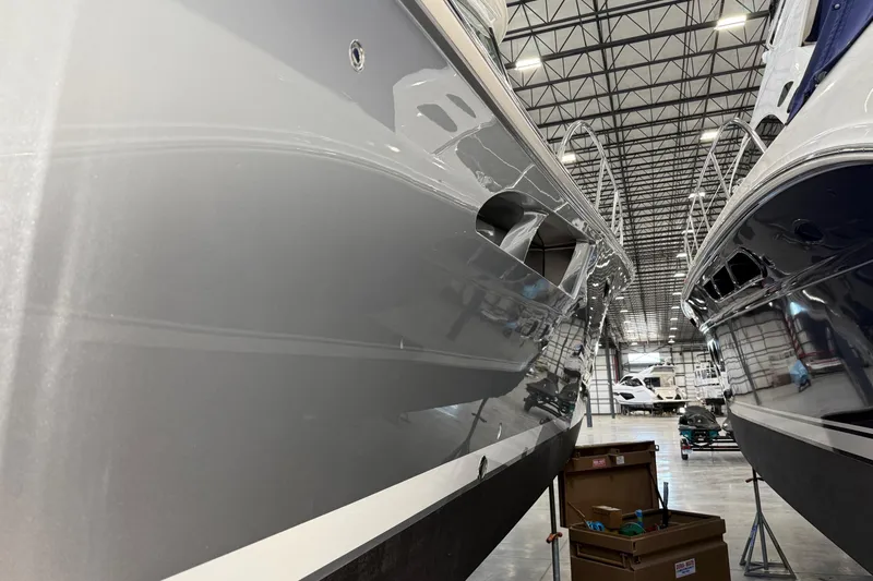  Yacht Photos Pics 2023 Tiara Yachts 43 Open in a spacious indoor marina setting.