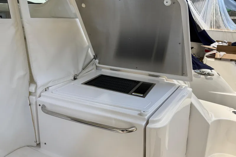  Yacht Photos Pics 2023 Tiara Yachts 43 Open yacht interior with open storage compartment.