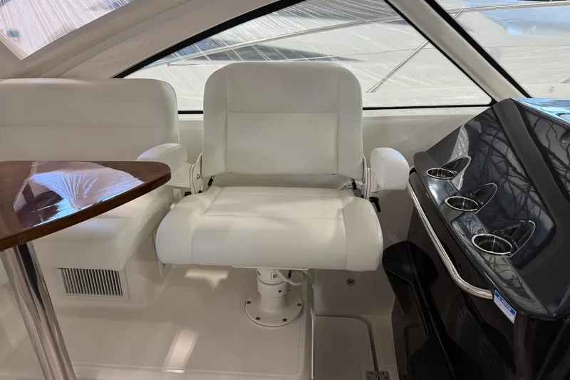  Yacht Photos Pics 2023 Tiara Yachts 43 Open interior with white seating and sleek helm design.