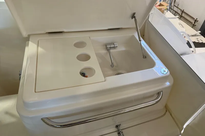  Yacht Photos Pics 2023 Tiara Yachts 43 Open sink with cover and faucet in white finish.