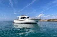 2018 Nimbus 365 yacht on calm blue waters under a clear sky.