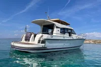 2018 Nimbus 365 yacht on clear blue water under a sunny sky.