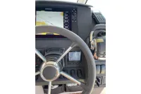 Steering wheel and navigation system of 2018 Nimbus 365 boat cockpit.