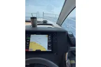 Cockpit view of 2018 Nimbus 365 with navigation display and ocean in background.