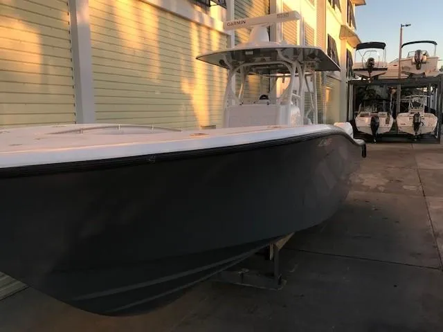  Yacht Photos Pics 2019 Yellowfin 34 Offshore boat docked in marina, side view.