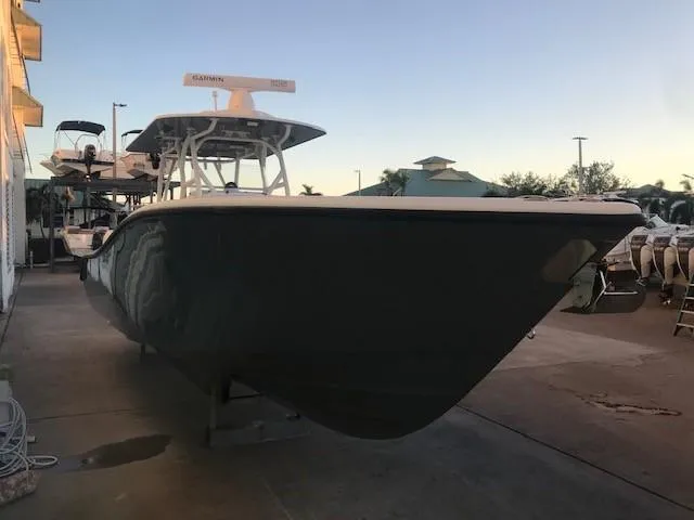  Yacht Photos Pics 2019 Yellowfin 34 Offshore boat docked at marina during sunset.