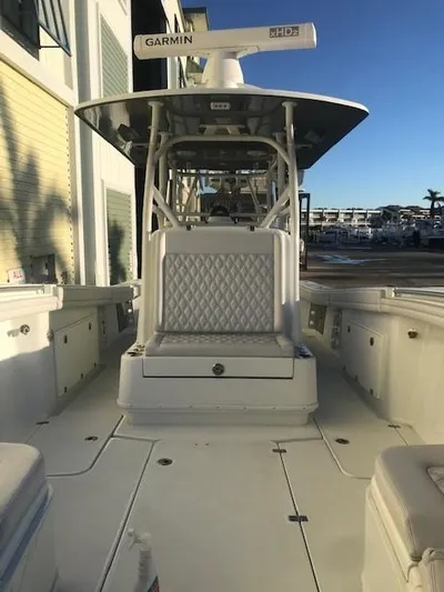  Yacht Photos Pics 2019 Yellowfin 34 Offshore boat with Garmin radar, docked in marina.