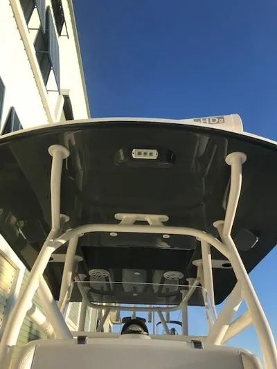  Yacht Photos Pics 2019 Yellowfin 34 Offshore boat, view of T-top and console against clear blue sky.