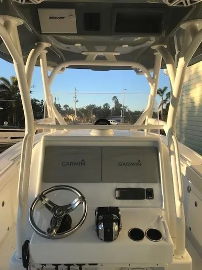  Yacht Photos Pics 2019 Yellowfin 34 Offshore boat dashboard with Garmin navigation system and Mercury controls.