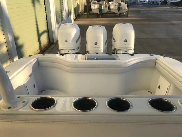  Yacht Photos Pics 2019 Yellowfin 34 Offshore boat with triple outboard engines and cup holders.