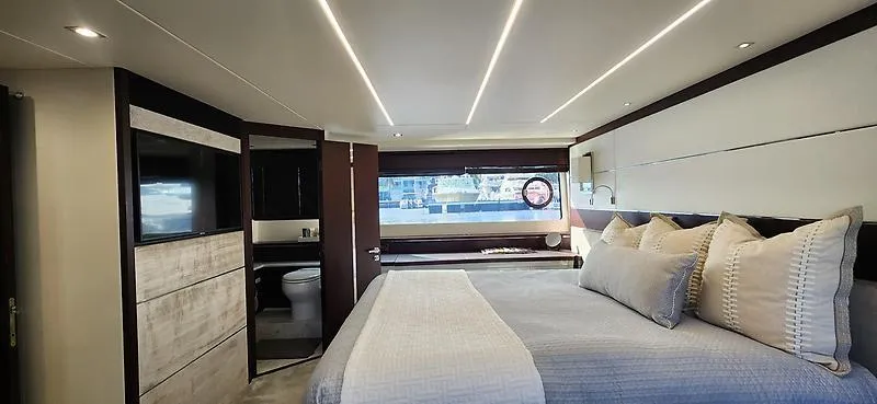  Yacht Photos Pics Luxurious bedroom interior of 2020 Sunseeker Predator 74 XPS yacht with modern design.
