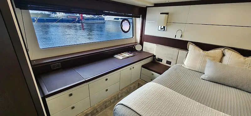  Yacht Photos Pics Luxurious interior of 2020 Sunseeker Predator 74 XPS yacht cabin with waterfront view.