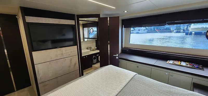  Yacht Photos Pics Luxurious interior of 2020 Sunseeker Predator 74 XPS yacht with large window and modern amenities.